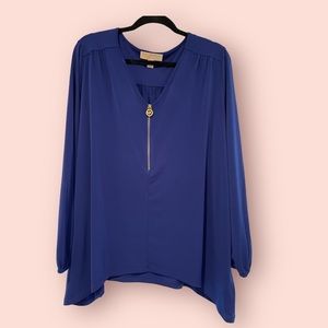 Vibrant blue woman’s Michael Kors top.